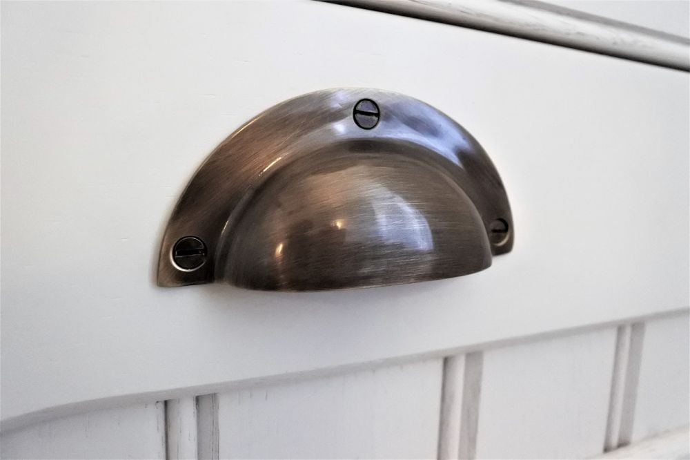Antique Brass cup handle on inframe kitchen