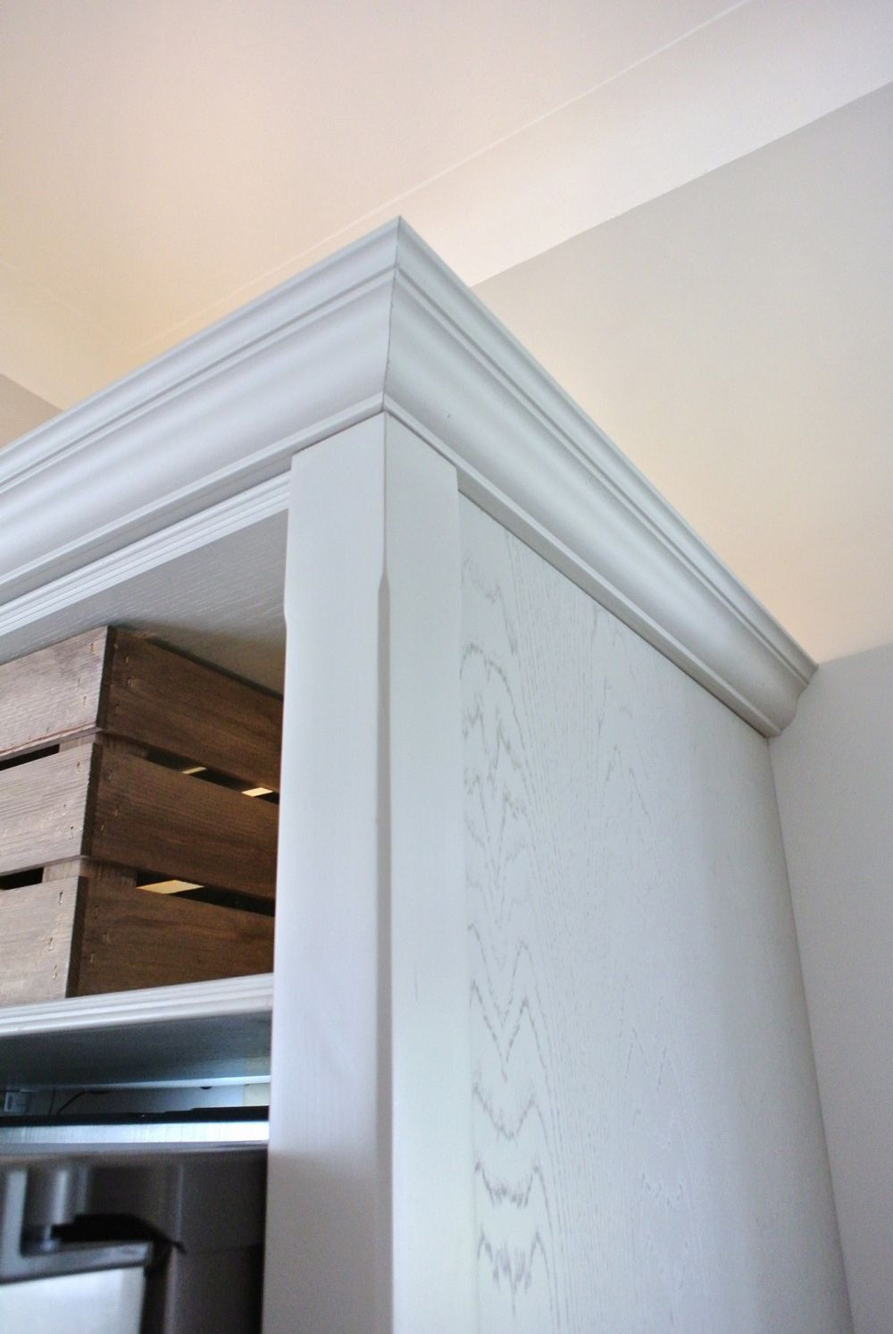 Block painted newel with detail chamfer, stunning Oak grain panel with crown mould cornice