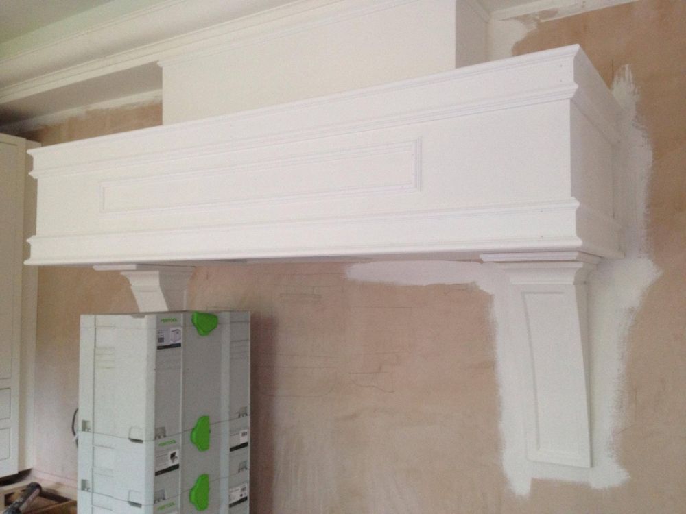 Bespoke floating mantle with large detail corbels, made from Oak panels. Primed ready for final coat of Farrow & Ball James White (2010)