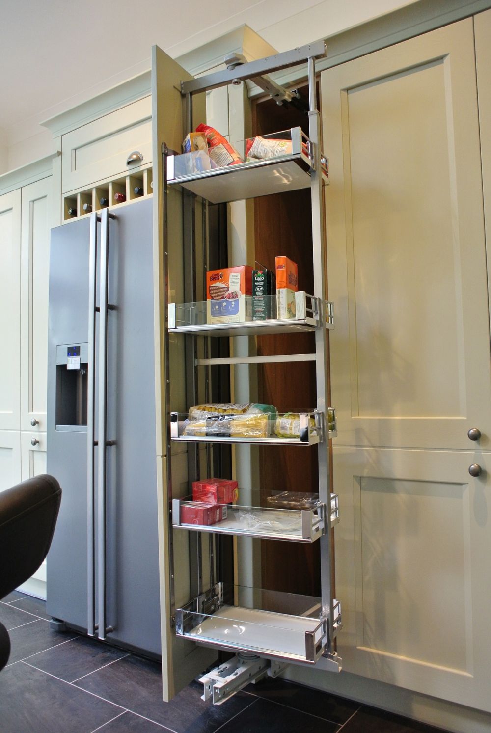 Rotating pull out larder. Pull towards you, push left or right, baskets spin 90 degrees for ease of access.