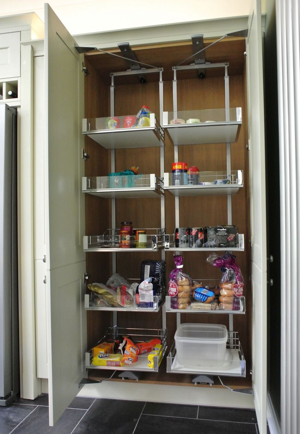 Tandem Larders in tall unit. Not called "Tandem" because there are Two. Double mechanisms control the operation when door is opened.