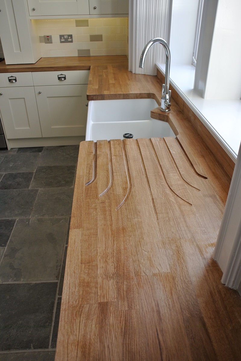 Bespoke Fan Tail drainer grooves in solid Oak work surface